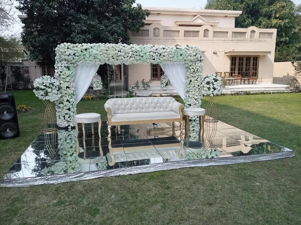 White floral mandap decor by Shoaib Caterers & Event Management, Lahore